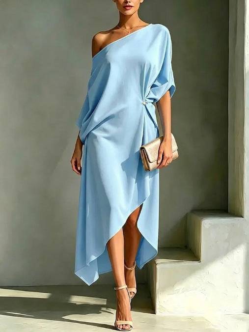 Elegant Calla asymmetric dress by THE WHITMORE FAMILY, featuring sleek design and sophisticated style, shown in the image.