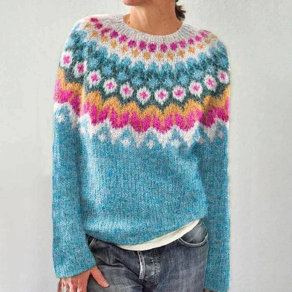 Colorful Icelandic sweater from THE WHITMORE FAMILY featuring a vibrant knit pattern and cozy, textured fabric.