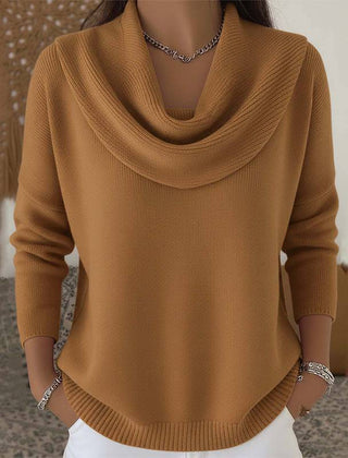 Women’s cowl neck sweater by THE WHITMORE FAMILY featuring a cozy knit design and relaxed fit, shown in a neutral color.