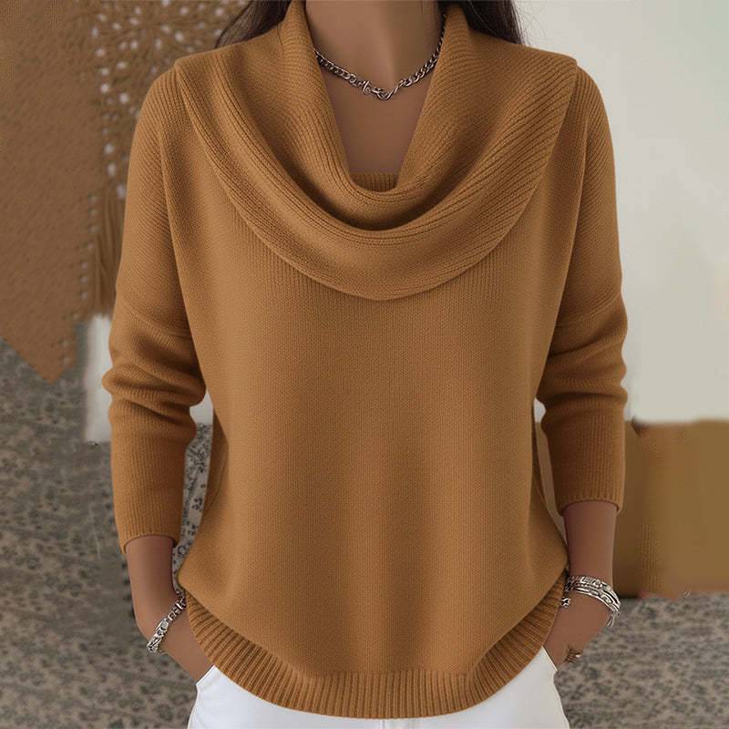 Women’s cowl neck sweater by THE WHITMORE FAMILY featuring a cozy knit design and relaxed fit, shown in a neutral color.
