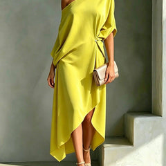 Elegant Calla asymmetric dress by THE WHITMORE FAMILY, featuring a stylish silhouette and sophisticated design.