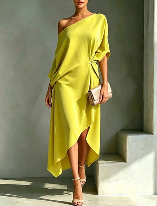 Elegant Calla asymmetric dress by THE WHITMORE FAMILY, featuring a stylish silhouette and sophisticated design.