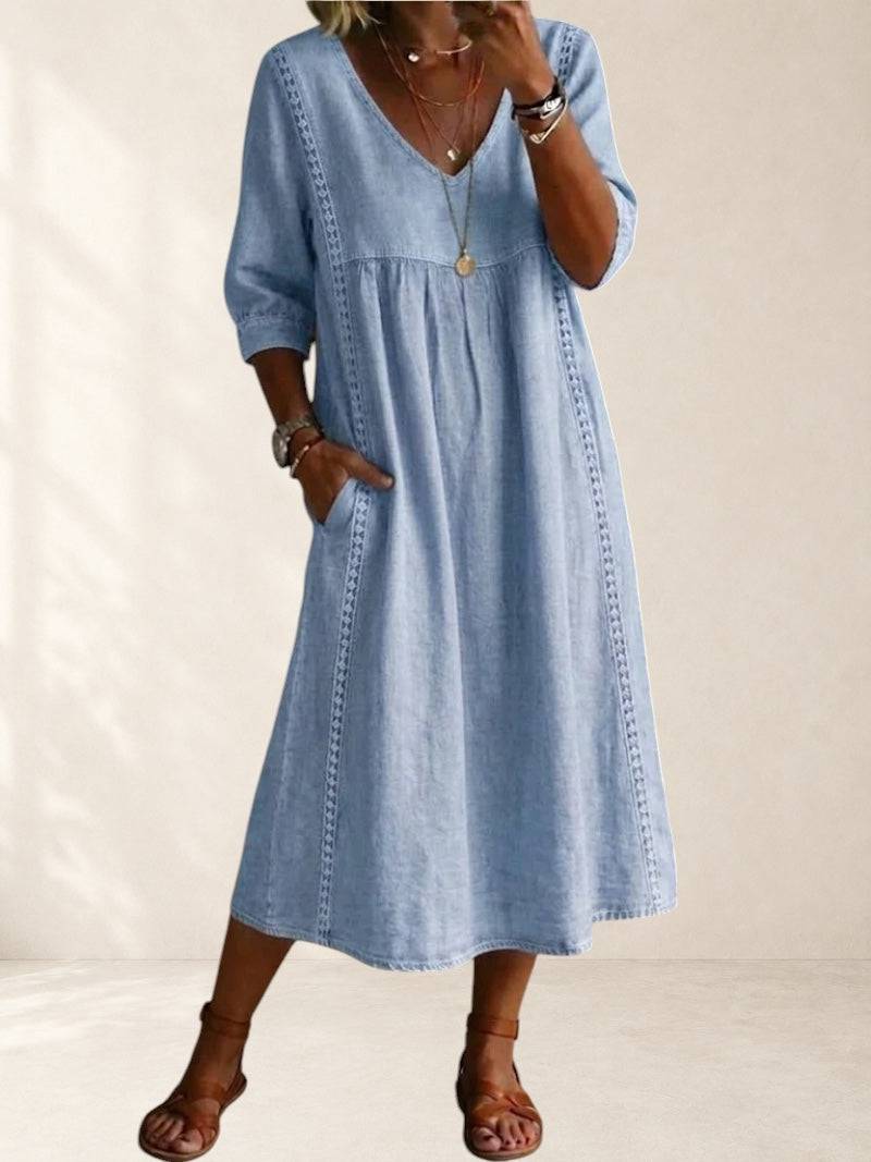 Mila relaxed pocket midi dress by THE WHITMORE FAMILY, shown in soft fabric with side pockets and a flowing silhouette.
