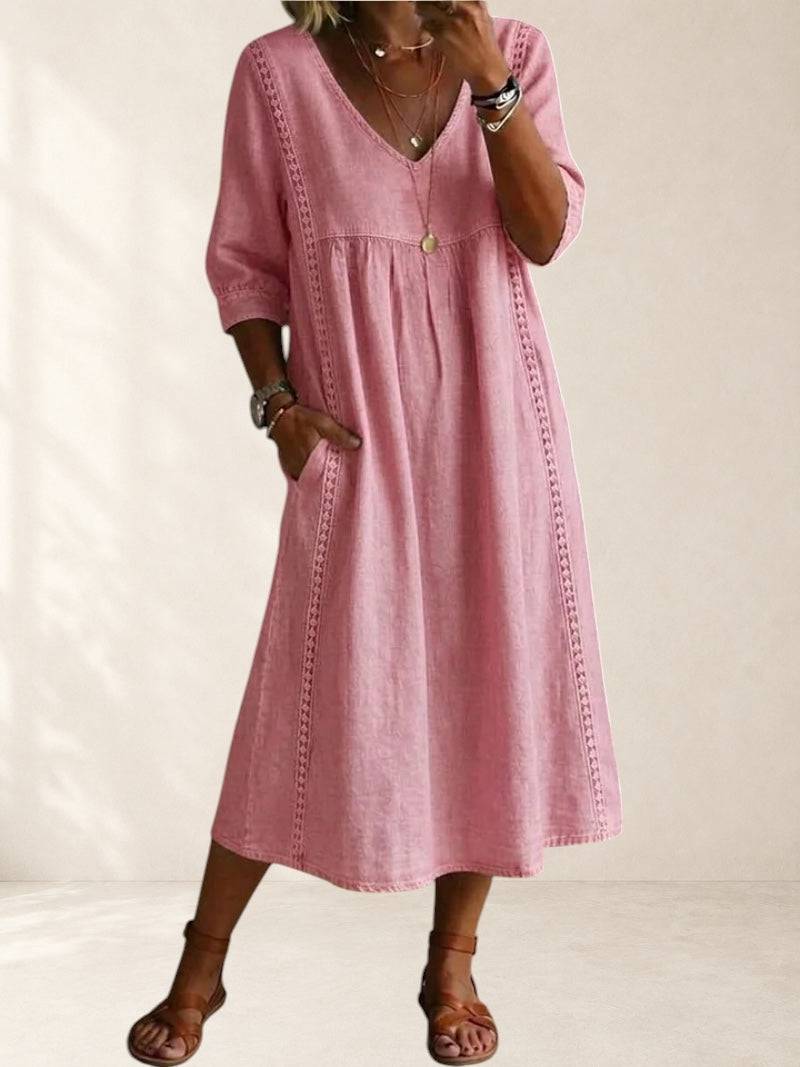 Mila relaxed pocket midi dress by THE WHITMORE FAMILY, featuring a flowy silhouette, short sleeves, and side pockets.