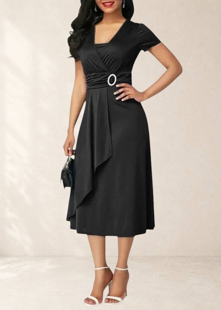 Elegant Zhyrelle midi dress by THE WHITMORE FAMILY, shown in a stylish design with a flattering fit and sophisticated look.