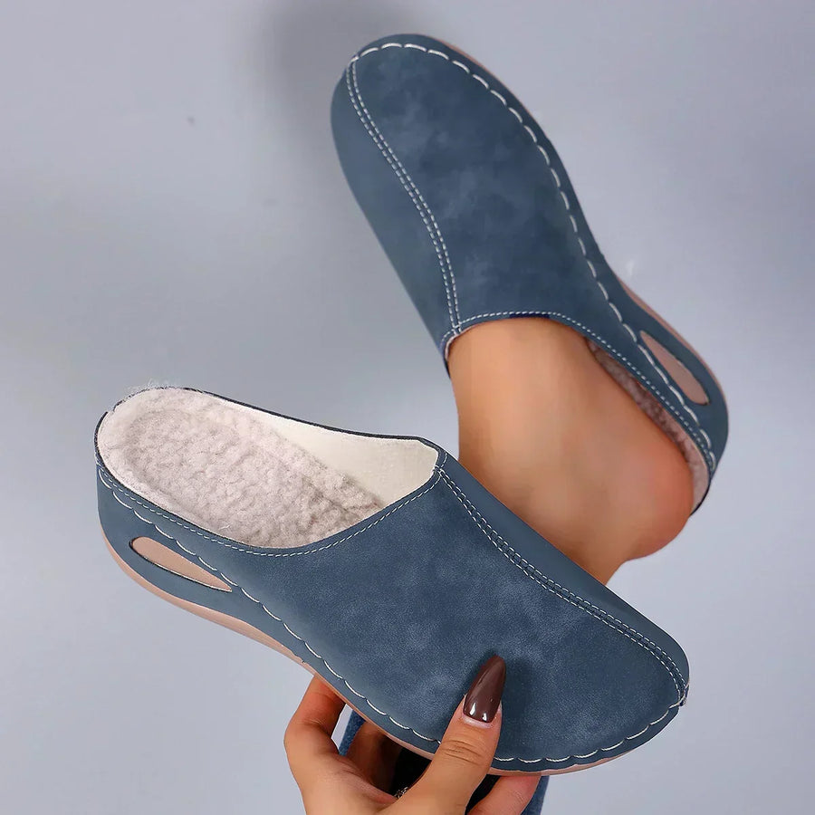Orthopedic slippers from THE WHITMORE FAMILY brand featuring comfortable, supportive shoes for enhanced foot comfort.