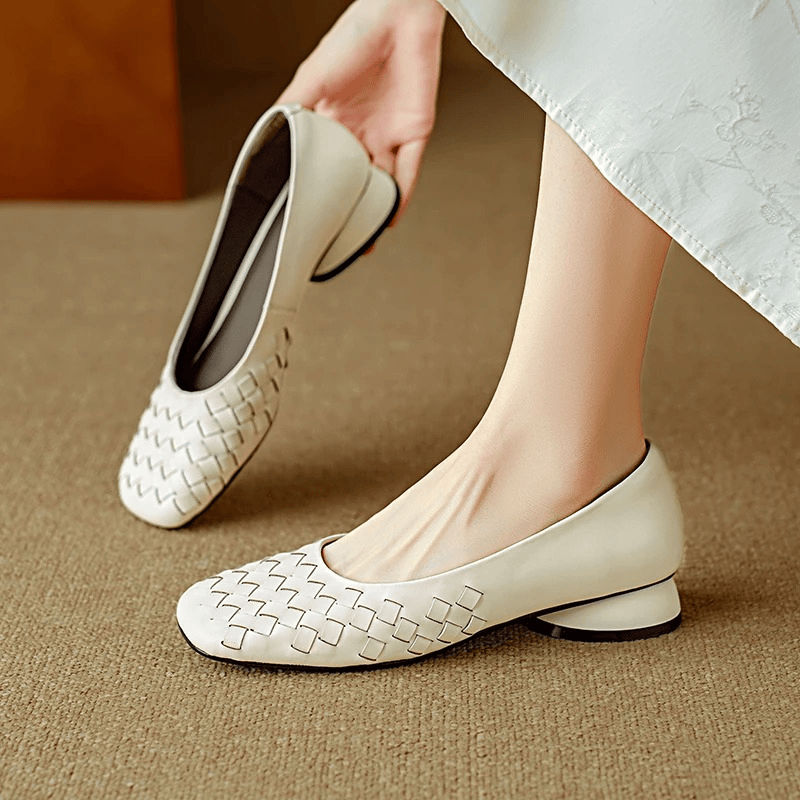 Marcelle Leather Flats by THE WHITMORE FAMILY featuring sleek black leather and comfortable slip-on style.