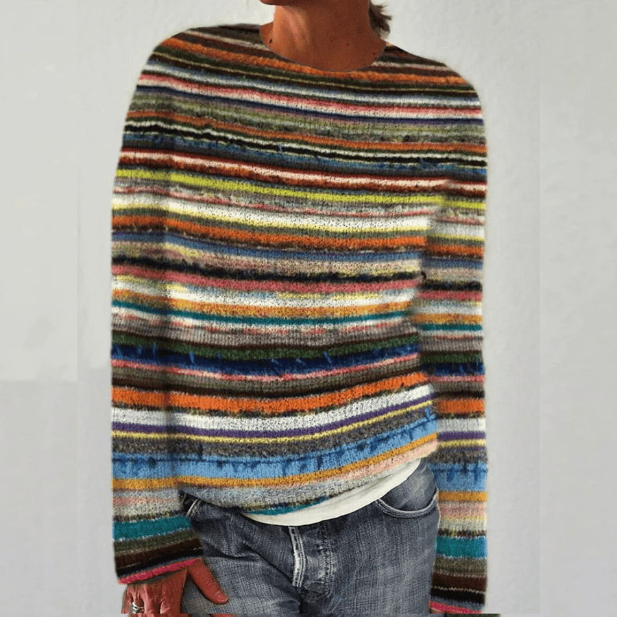 Colorful retro Scandinavian knitted sweater by THE WHITMORE FAMILY featuring vibrant rainbow patterns on soft fabric.