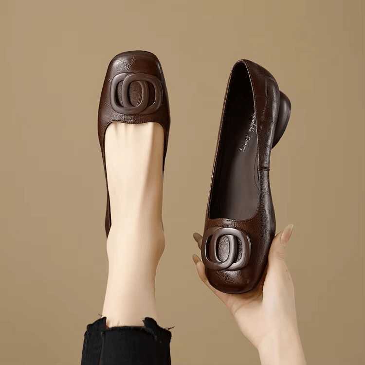 Black Opium leather flats by THE WHITMORE FAMILY, featuring sleek design and comfortable slip-on style.