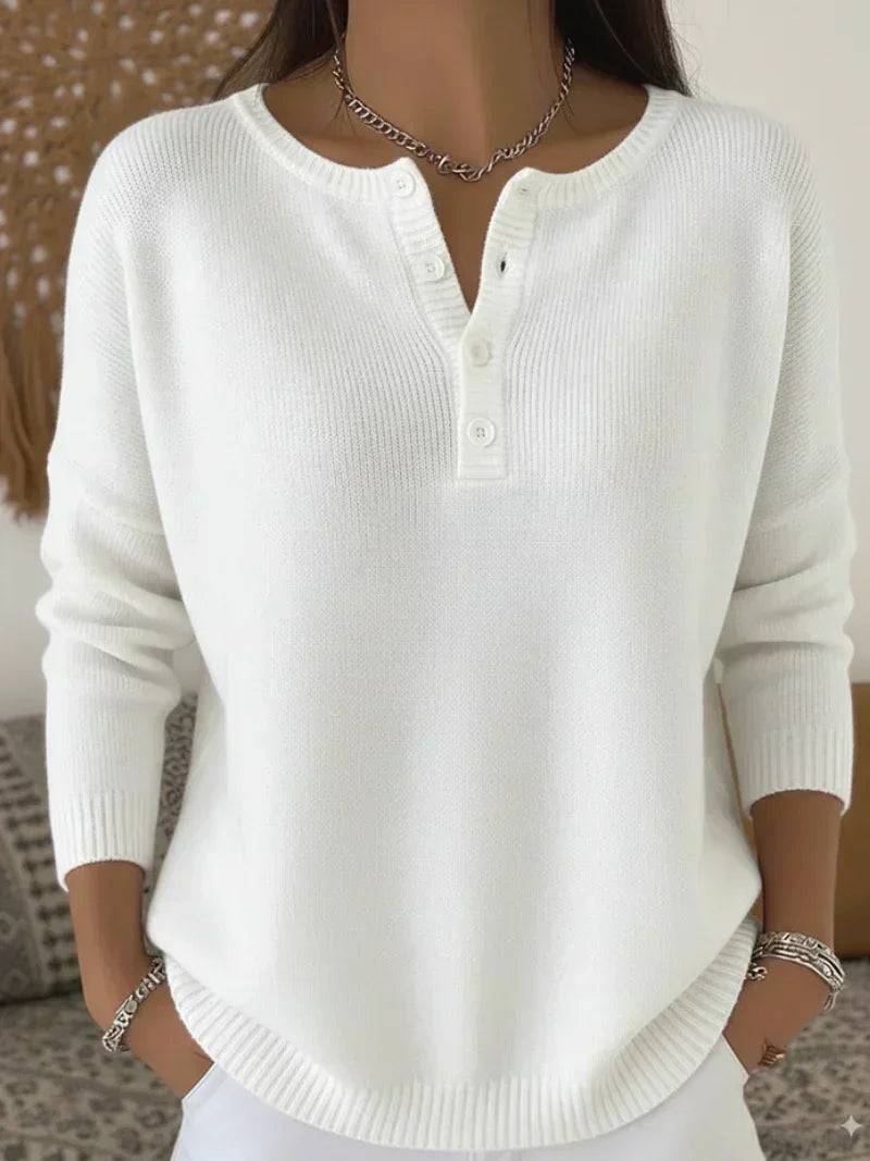 White Henley button-up knit sweater for women by THE WHITMORE FAMILY, featuring a classic collar and cozy knit texture.