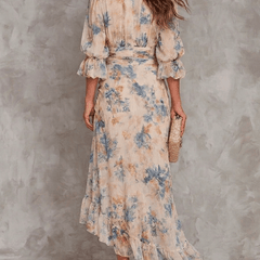 Floral maxi dress by THE WHITMORE FAMILY featuring a flowy design and vibrant flower patterns, perfect for summer or casual wear.