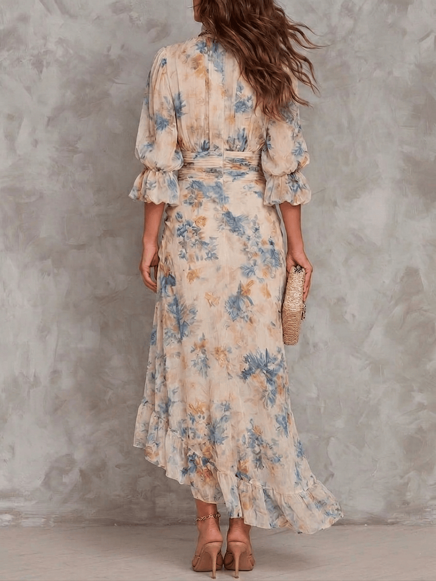Floral maxi dress by THE WHITMORE FAMILY featuring a flowy design and vibrant flower patterns, perfect for summer or casual wear.
