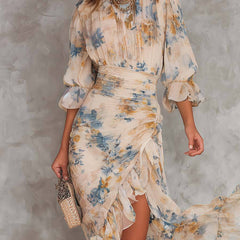 Floral maxi dress by THE WHITMORE FAMILY, featuring a flowing design and vibrant floral pattern, shown on a model.