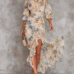 Yellow floral maxi dress from THE WHITMORE FAMILY's Cora collection, featuring a flowing silhouette and vibrant flower patterns.
