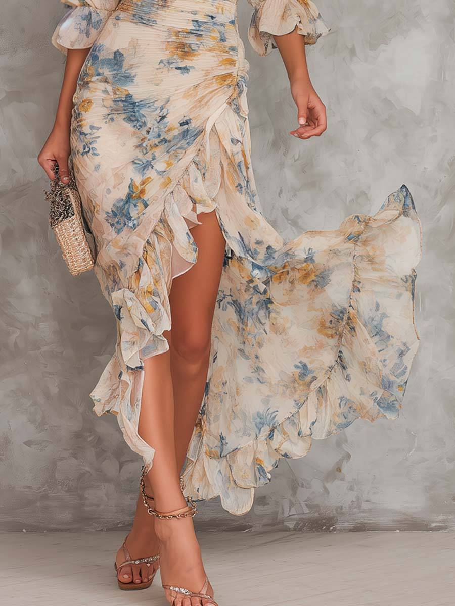 Cora floral maxi dress by THE WHITMORE FAMILY, flowing fabric with vibrant floral pattern, full-length dress on a hanger.