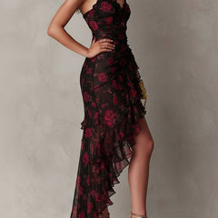 Lane floral ruched hem dress by THE WHITMORE FAMILY featuring a vibrant floral pattern and a ruched hem detail.
