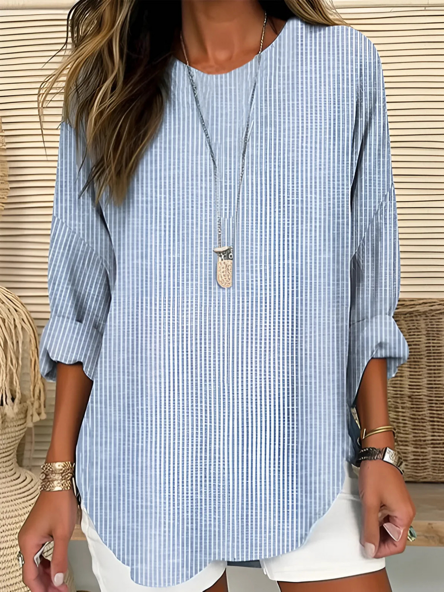Trendy Rhea striped blouse by THE WHITMORE FAMILY, featuring a casual fit with bold horizontal stripes in various colors.