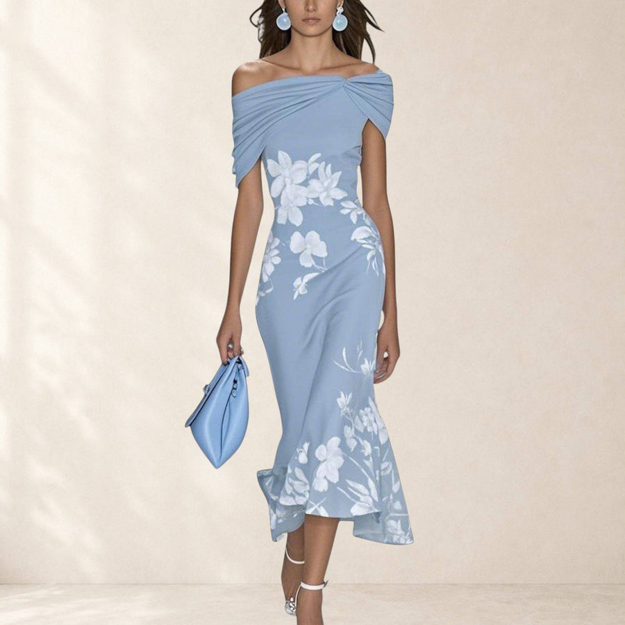 Elegant Isabrunel midi dress by THE WHITMORE FAMILY, featuring a fitted silhouette and stylish design, displayed on a mannequin.