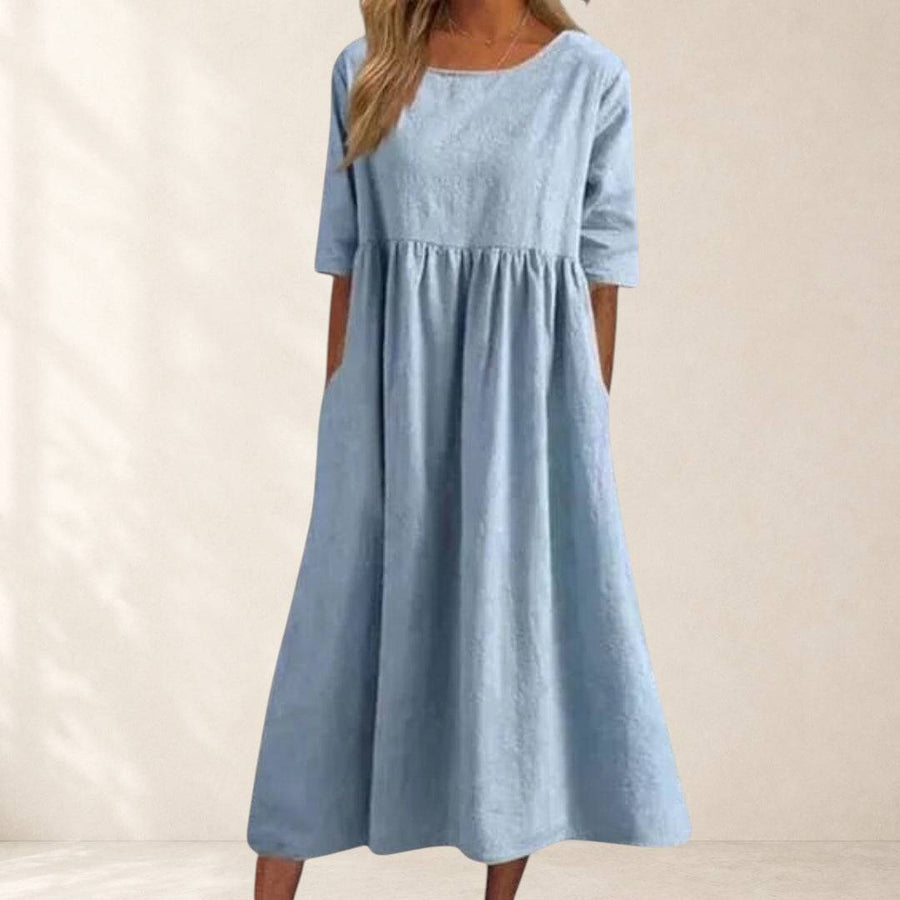 Elegant short-sleeved Haisley™ dress from THE WHITMORE FAMILY, shown in a flattering fit with a stylish, classic design.