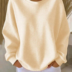 Women’s classic sweater by THE WHITMORE FAMILY, cozy knit jumper in neutral color, featuring a round neckline and long sleeves.