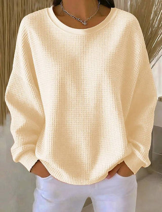 Women’s classic sweater by THE WHITMORE FAMILY, cozy knit jumper in neutral color, featuring a round neckline and long sleeves.
