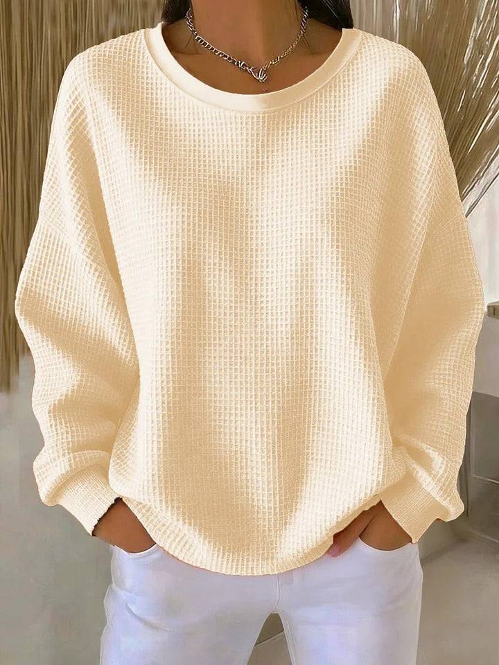 Women’s classic sweater by THE WHITMORE FAMILY, cozy knit jumper in neutral color, featuring a round neckline and long sleeves.