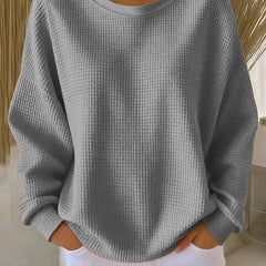 Women’s classic sweater jumper by THE WHITMORE FAMILY, soft knit with a cozy fit, shown in a neutral color on a mannequin.