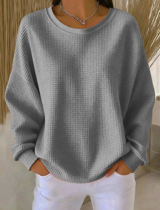 Women’s classic sweater jumper by THE WHITMORE FAMILY, soft knit with a cozy fit, shown in a neutral color on a mannequin.