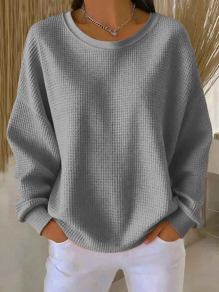 Women’s classic sweater jumper by THE WHITMORE FAMILY, soft knit with a cozy fit, shown in a neutral color on a mannequin.