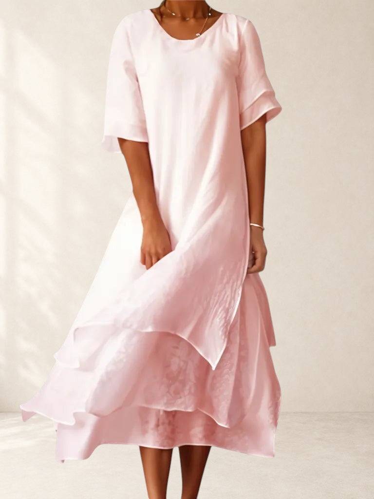 Elegant April™ dress by THE WHITMORE FAMILY, featuring a flowing fabric and stylish design, perfect for formal occasions.