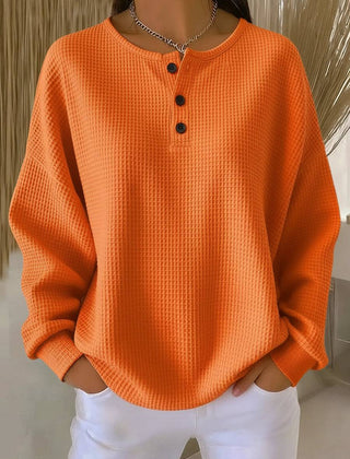 Cosy waffle henley sweatshirt for women by THE WHITMORE FAMILY, featuring a soft, textured fabric and classic henley neckline.