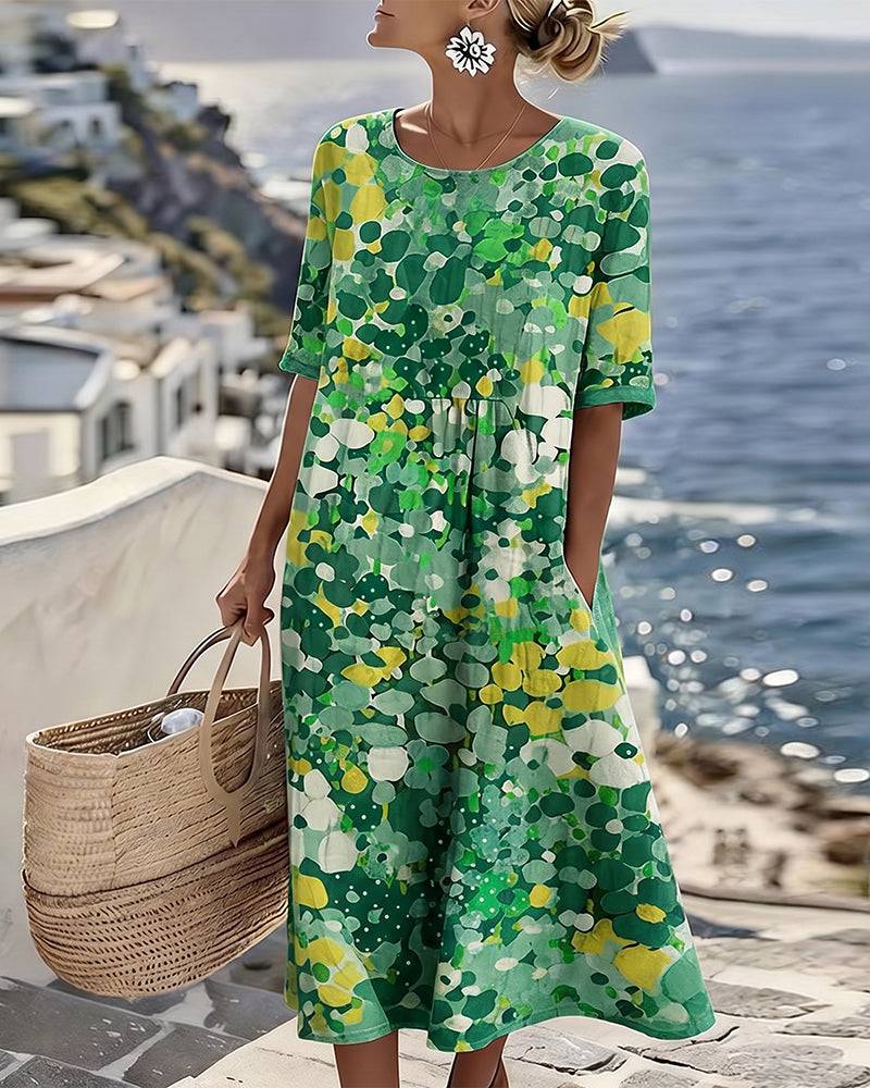 Elegant floral summer midi dress by THE WHITMORE FAMILY, featuring a flowing design with vibrant floral patterns.