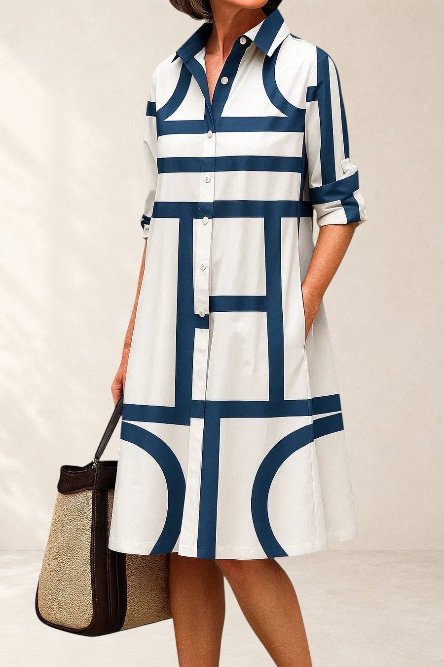 Elegant Skarlette midi dress by THE WHITMORE FAMILY, shown in a stylish, flowing design with a fitted silhouette and subtle detailing.