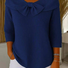 Women’s sweater with round neckline and bow detail by THE WHITMORE FAMILY, featuring a cozy knit fabric and classic fit.