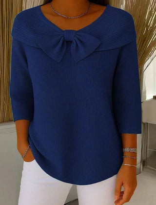 Women’s sweater with round neckline and bow detail by THE WHITMORE FAMILY, featuring a cozy knit fabric and classic fit.