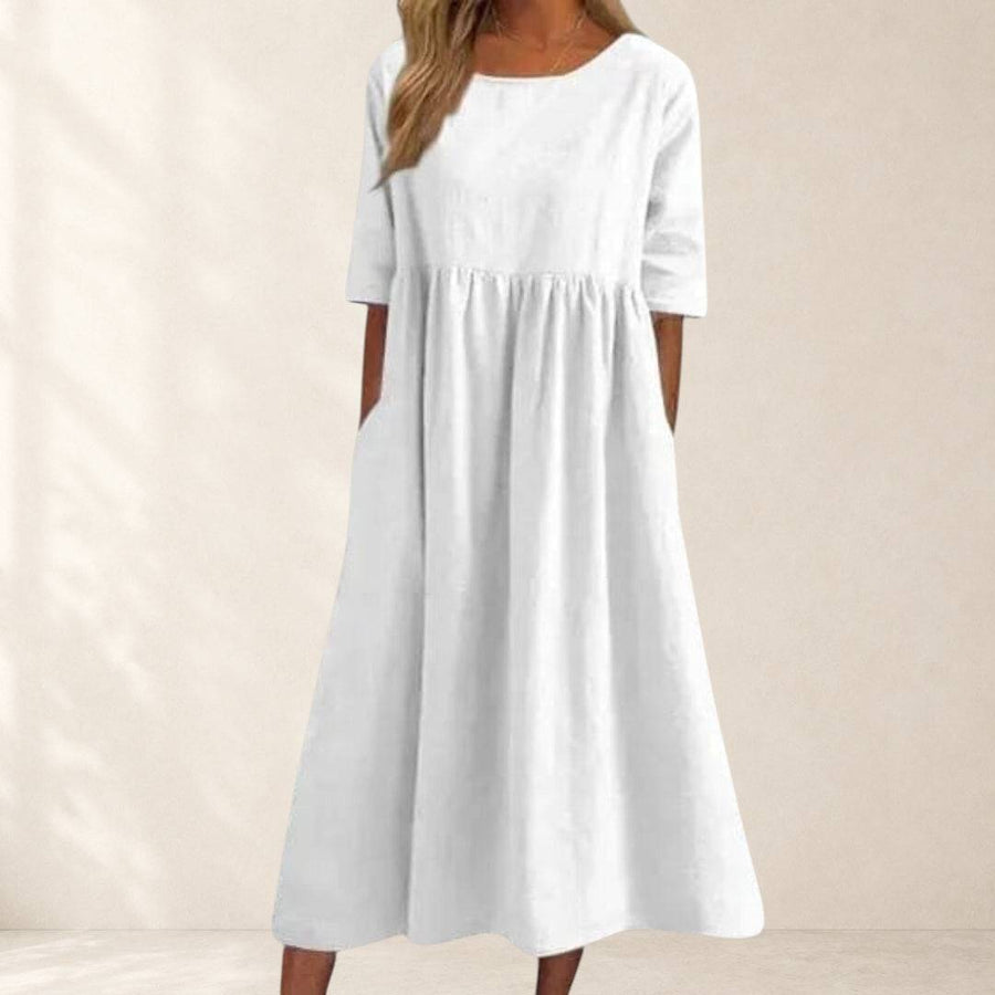 Elegant Haisley™ short-sleeved dress by THE WHITMORE FAMILY, featuring a stylish fit and classic design for casual or semi-formal wear.