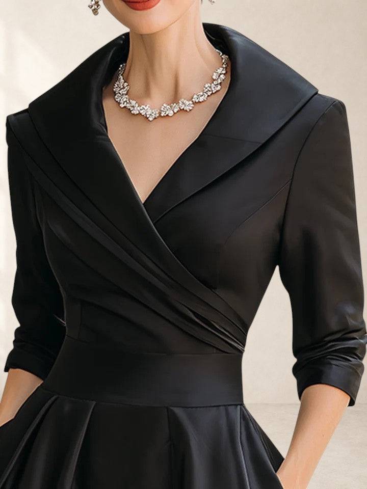 Elegant Yan midi dress by THE WHITMORE FAMILY featuring a fitted bodice and flowing skirt in a sophisticated design.
