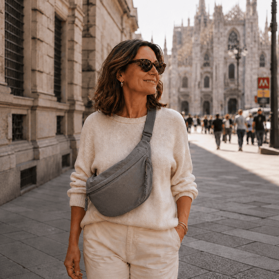 Gray Chiara shoulder bag by THE WHITMORE FAMILY, featuring a sleek design with adjustable straps and spacious interior.