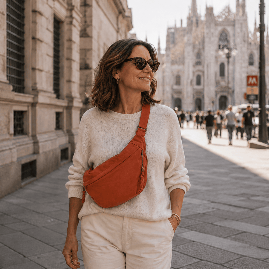 Orange shoulder bag from THE WHITMORE FAMILY Gioia collection, featuring a stylish design with a top handle and shoulder strap.