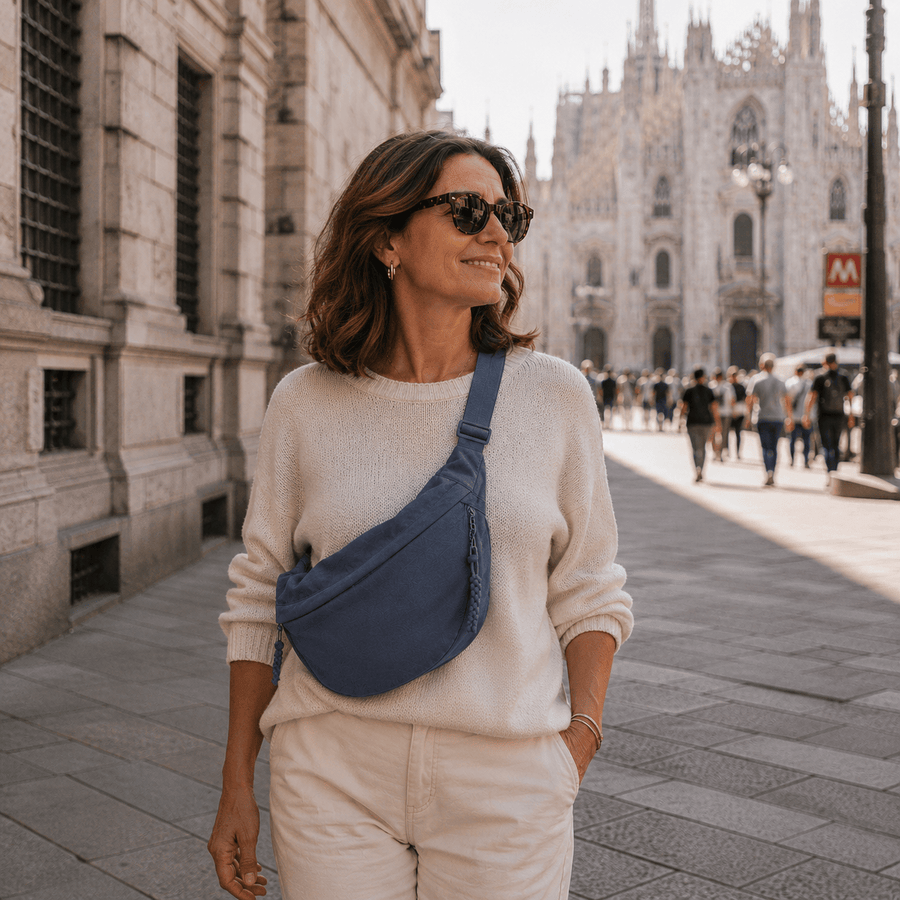 Blue Mara crossbody bag by THE WHITMORE FAMILY, showing sleek design and adjustable strap on a neutral background.