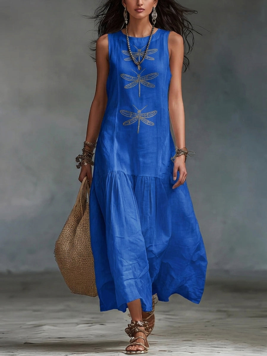 Geneva sleeveless maxi dress by THE WHITMORE FAMILY, flowing fabric, V-neck style, and elegant design perfect for summer occasions.