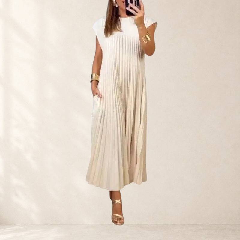 Mariana™ elegant dress by THE WHITMORE FAMILY, featuring a flowing fabric and sophisticated design, worn by a model.