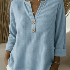 Women’s Henley button sweater by THE WHITMORE FAMILY, featuring a cozy knit fabric and classic henley neckline.