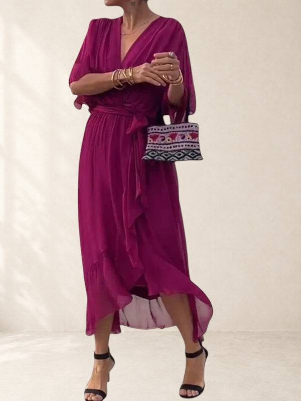 Elegant Bethany dress by THE WHITMORE FAMILY, featuring a flowing fabric and intricate design in a sophisticated style.