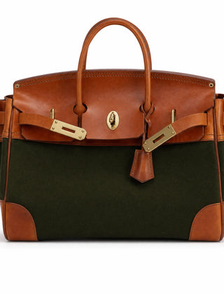 Green The Eleanor Weekender bag by THE WHITMORE FAMILY showing its spacious design and sturdy handles.