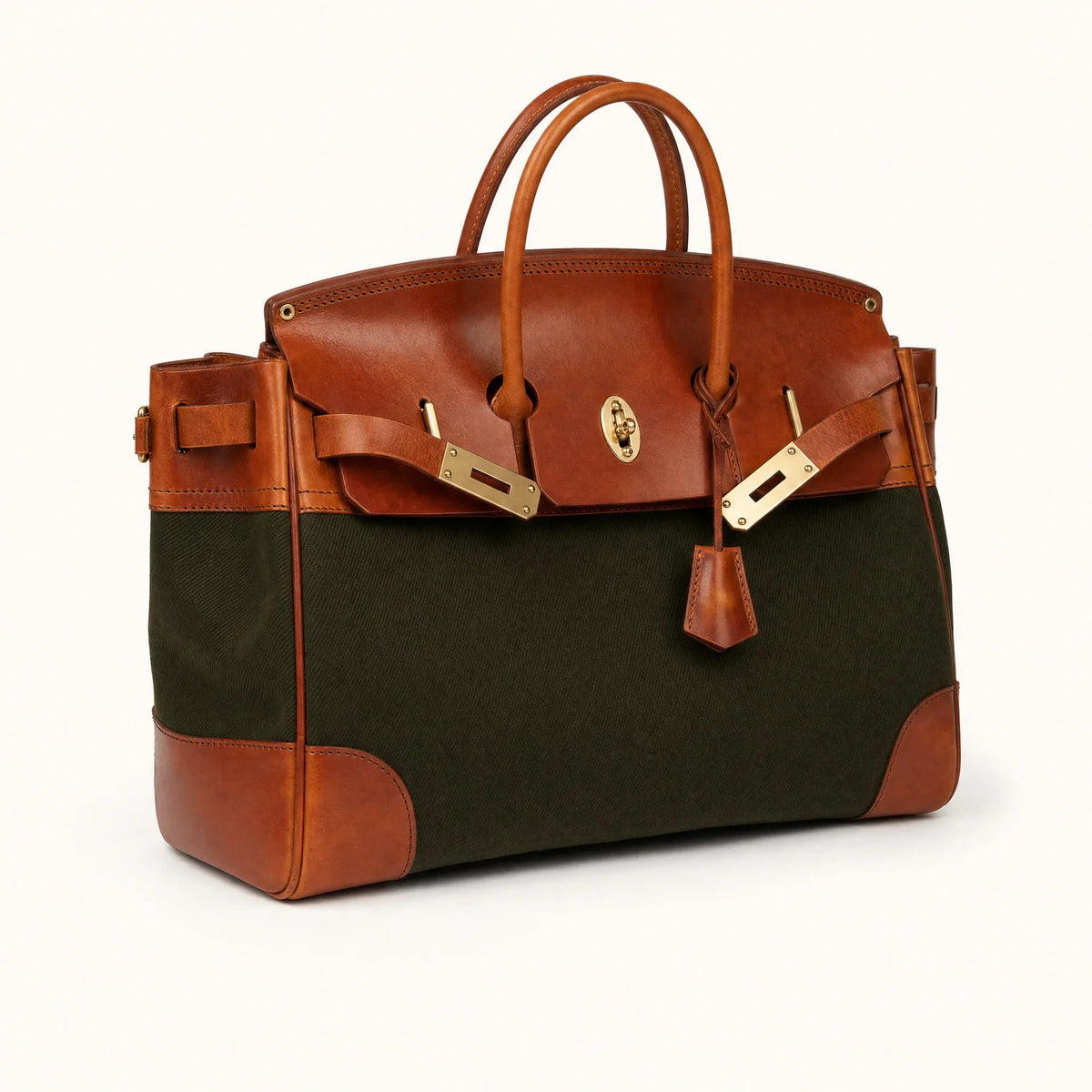 Green The Eleanor Weekender bag by THE WHITMORE FAMILY with leather handles and spacious interior for travel and weekend trips.