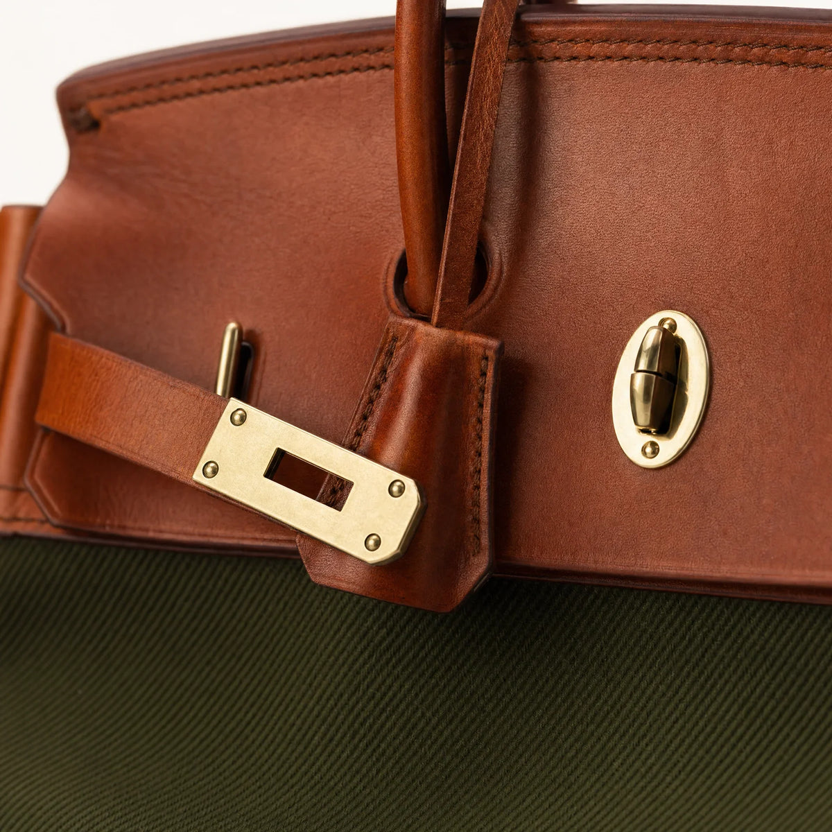 Green The Eleanor Weekender bag by THE WHITMORE FAMILY with sturdy handles and spacious interior for travel and weekend trips.