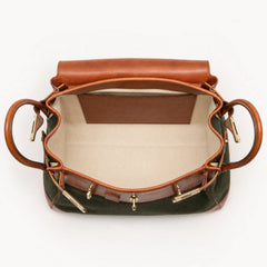 Green Eleanor Weekender bag by THE WHITMORE FAMILY, showing the spacious fabric tote with leather handles and sturdy design.