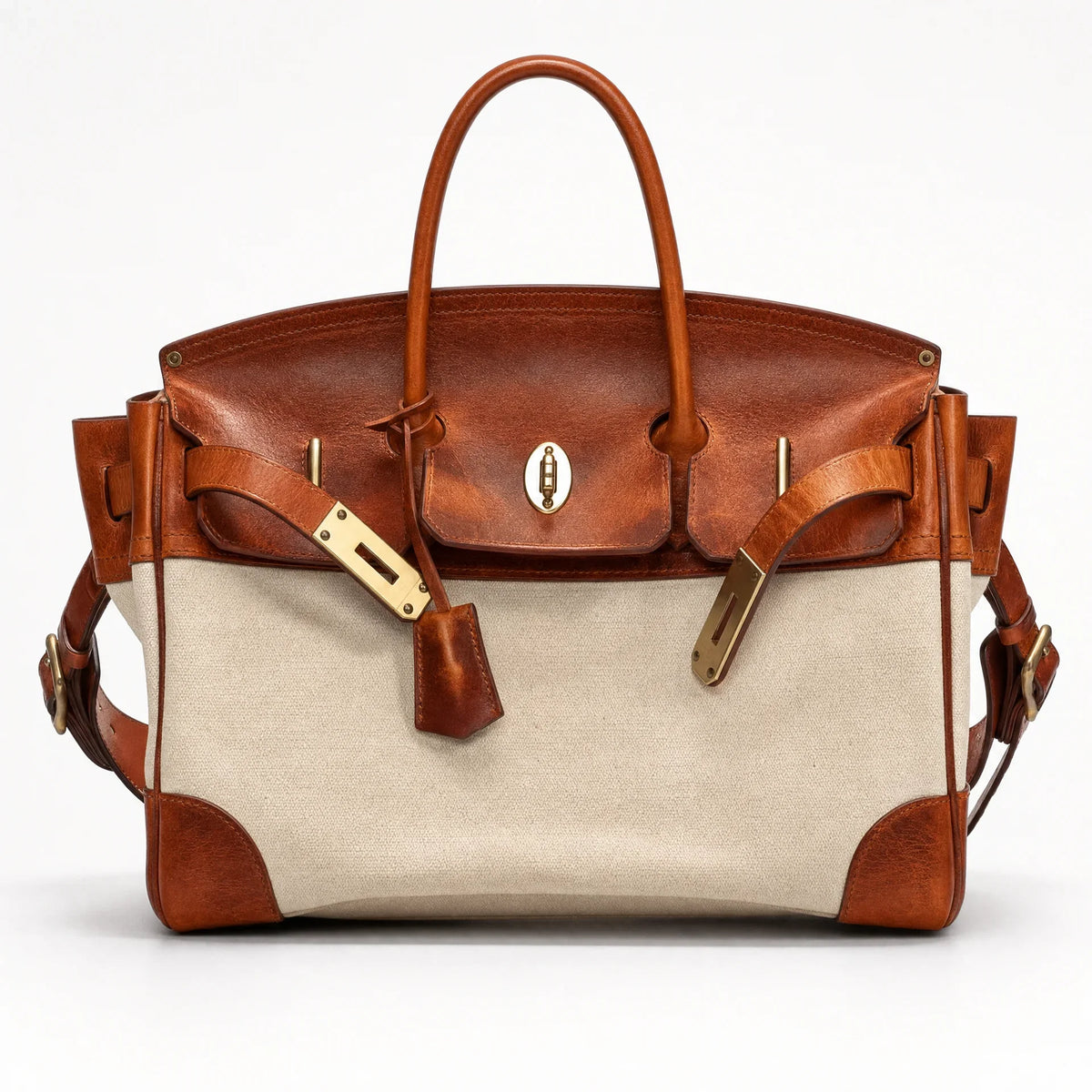 The Eleanor Weekender bag from THE WHITMORE FAMILY featuring durable canvas material and leather accents, perfect for travel.