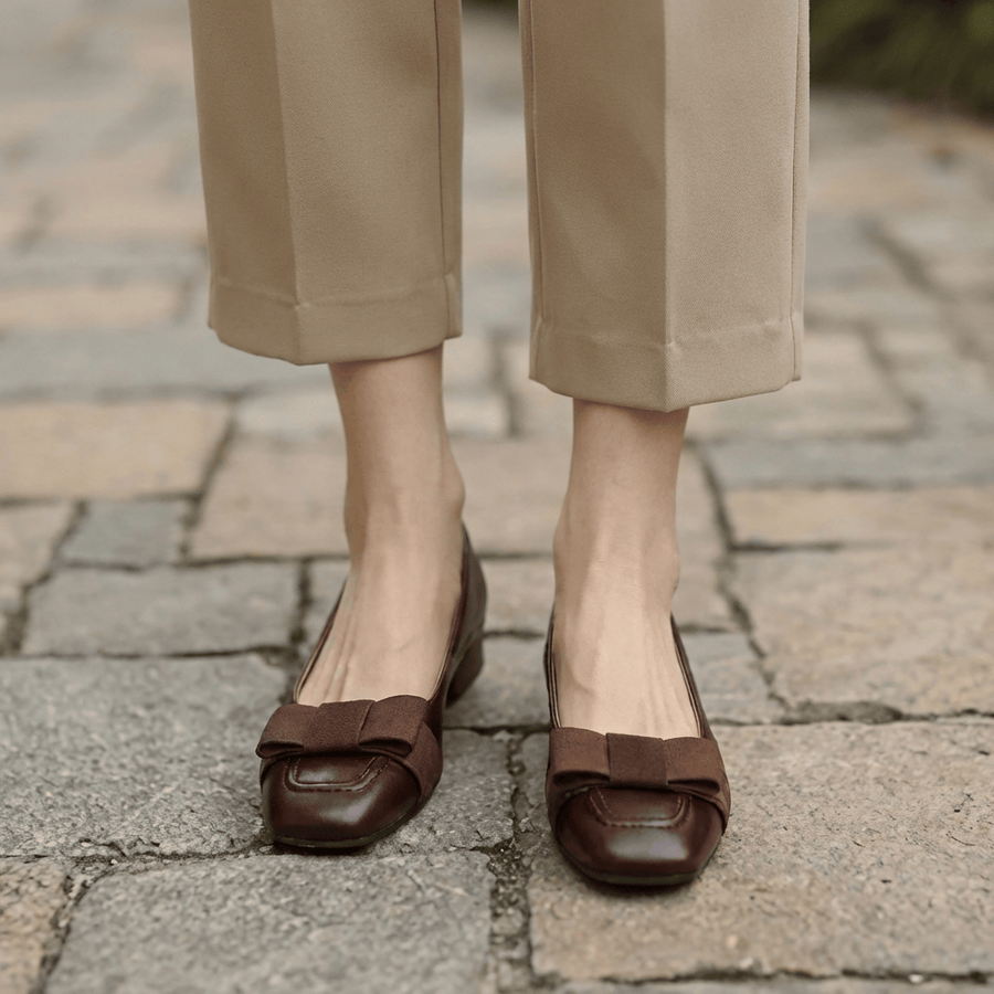Camille Bow Leather Flats by THE WHITMORE FAMILY featuring pointed toe, bow detail, and sleek leather upper, perfect for casual wear.